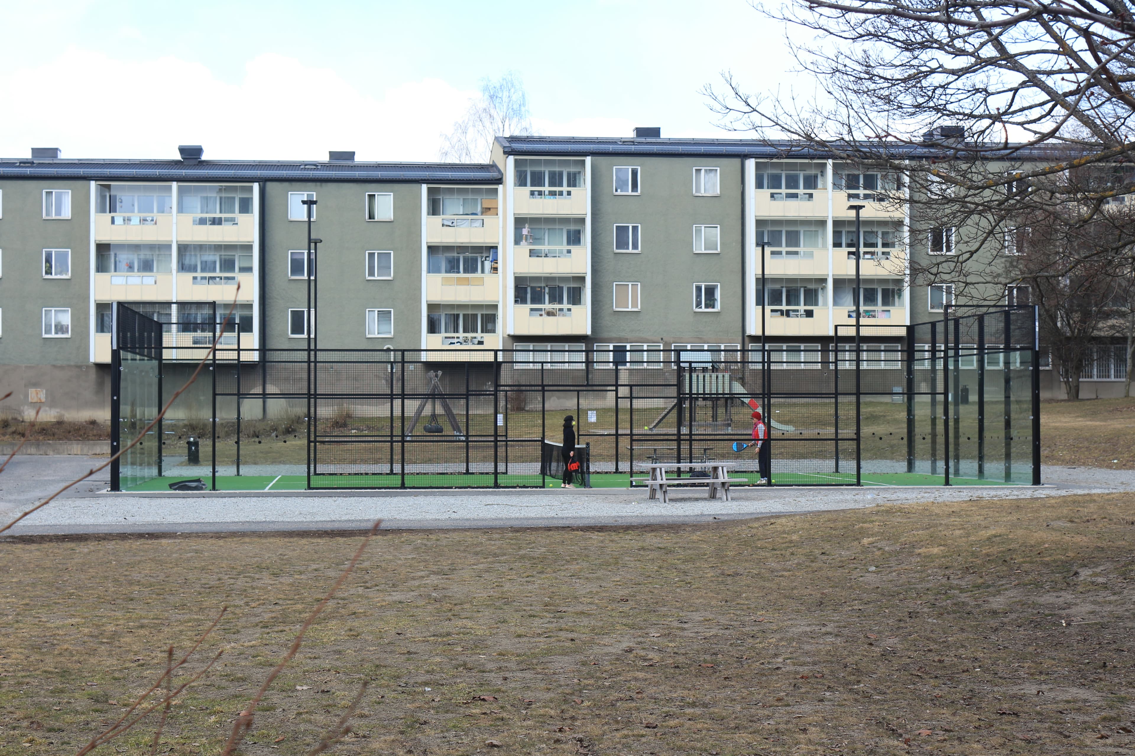 A glass-walled padel court